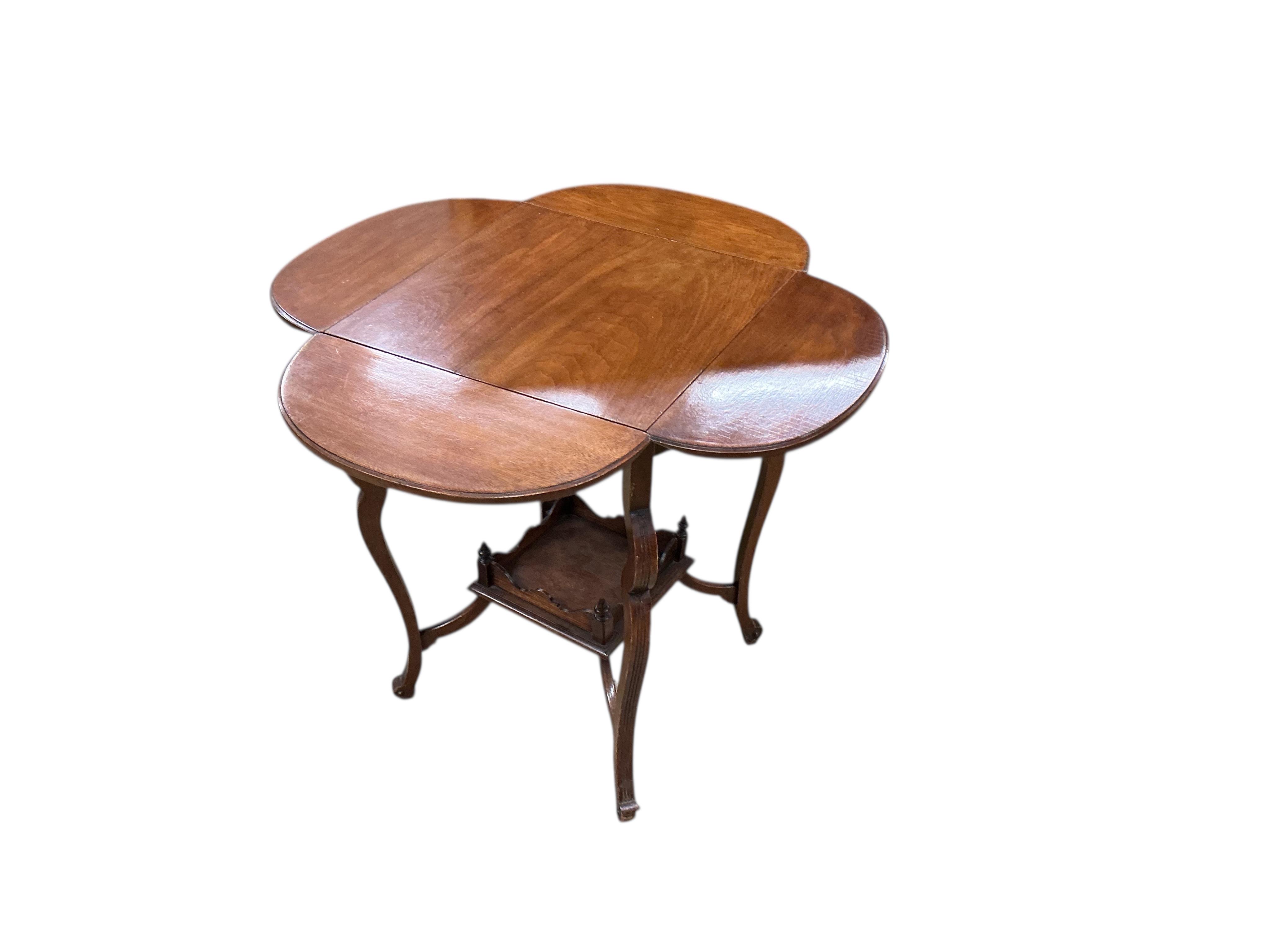 A late Victorian walnut drop flap centre table, width 45cm, height 68cm